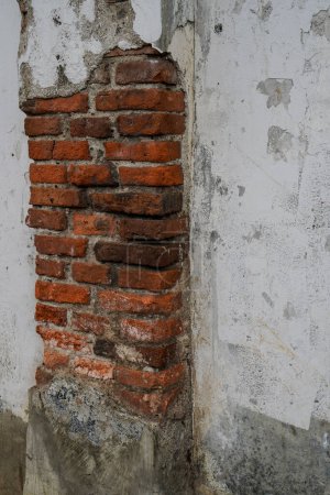 Photo for Looks close to the wall which has been removed until the red brick is visible - Royalty Free Image