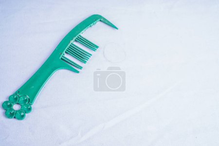 damaged hair comb isolated on white with empty space for advertising photocopy.