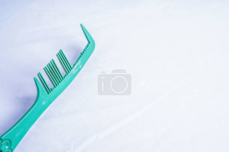 damaged hair comb isolated on white with empty space for advertising photocopy.