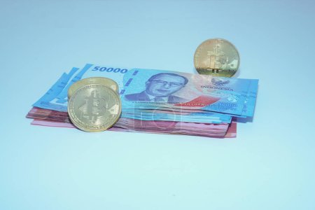 isolated bitcoin and indonesian money with empty space for advertising.