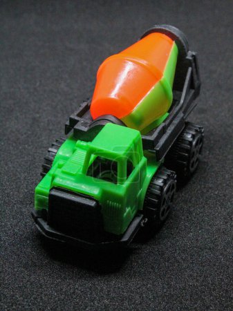 Photo for Children's cement truck toy, isolated black - Royalty Free Image