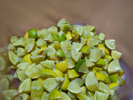 Several lime slices in a container