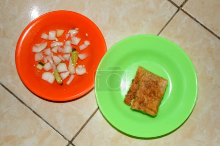Egg martabak with sliced dish