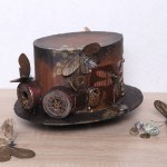 vintage steampunk hat on a wooden table with butterflies and leaves