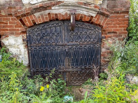 Photo for Old wooden door in the ruins of an old church in the village - Royalty Free Image