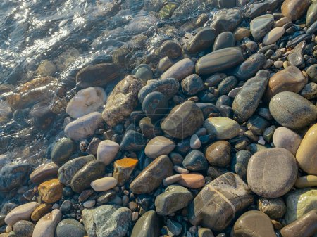 pebble stones on the shore of the sea, natural background