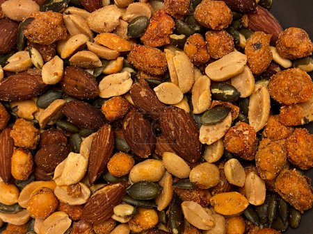 Close up of mixed nuts and seeds. Food background. Whole background.