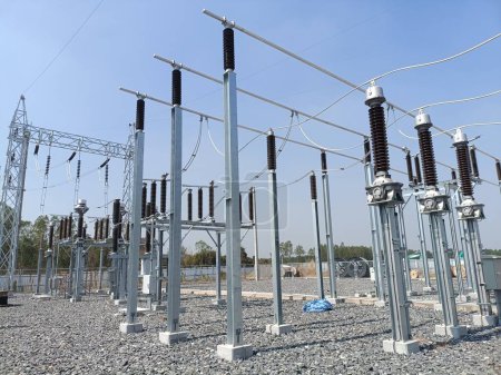 Photo for High voltage transformer and fire wall with electrical circuit poles - Royalty Free Image
