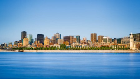 Photo for Montreal city skyline over Saint Lawrence River in the morning with urban buildings, Montreal, Quebec, Canada - Royalty Free Image