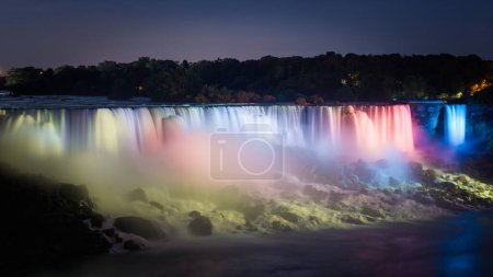 Photo for American Falls lit by colorful night lights, Niagara Falls, Ontario, Canada - Royalty Free Image