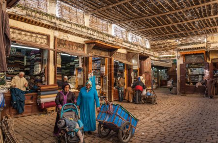 Photo for FEZ - DECEMBER 22, 2014 : A small square in the souk where textiles are sold. - Royalty Free Image