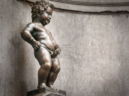 Photo for BRUSSELS, BELGIUM - APRIL 4: The famous Mannekene Pis, the iconic statue of Brussels on April 4, 2014 in Brussels - Royalty Free Image
