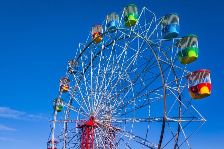 Photo for View of the colorful Sydney Luna Park Ferris Wheel against blue sky - Royalty Free Image