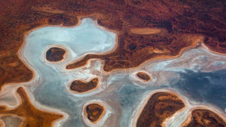 Photo for Aerial view of a colorful salt lake, Queensland, Australia. Salts lakes occur in arid or semi-arid zones of the Australian continent and collect precipitations that evaporate without reaching sea - Royalty Free Image