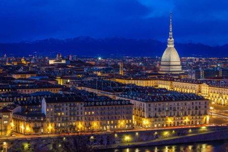 Photo for Panoramic view of Turin with Mole Antonelliana and snow capped Alps, Turin at dust, Italy - Royalty Free Image