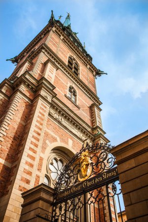 Photo for The bell tower and the northern gate of Tyska Kyrkan, the German Church dedicated to Saint Gertrude in Gamla Stan, Stockholm, Sweden. The German words over the gate mean Fear God! Honor the king! - Royalty Free Image