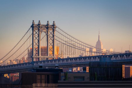 Photo for NEW YORK - CIRCA OCTOBER 2016: Manhattan Bridge and the Empire State Building, New York City, USA - Royalty Free Image