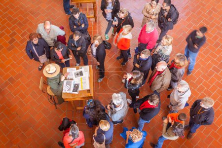 Photo for NEW YORK - CIRCA OCTOBER 2016: People at a Registration Desk in the Registration Hall, Ellis Island during a ranger-guided tour, New York City, USA - Royalty Free Image