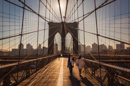 Photo for NEW YORK - CIRCA OCTOBER 2016: The Brooklyn Bridge with people walking and cycling on the pedestrian walkway, New York City, USA - Royalty Free Image