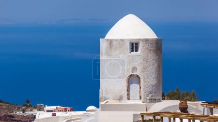 Photo for Old windmill against blue sky and sea, Santorini, Greece - Royalty Free Image