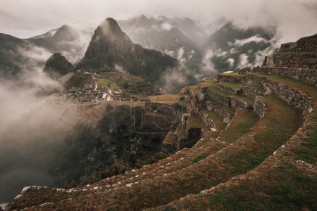 Photo for Panoramic view of the archeological site of Machu Picchu with Huayna Picchu (Wayna Picchu) mountain, Cusco Peru. One of the seven wonders; UNESCO World Heritage. - Royalty Free Image