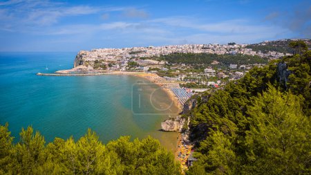Photo for Panoramic view of Peschici with its golden beaches and rock formations, Gargano, Italy - Royalty Free Image