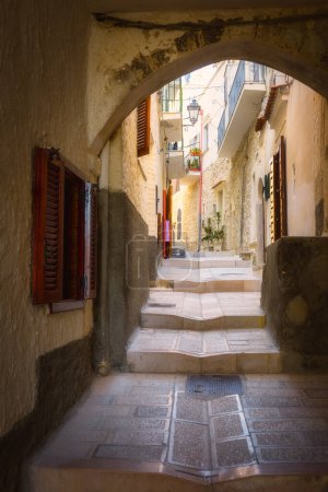 A picturesque alley in the old town of Vieste, a famous seaside town in Gargano National Park, Puglia, Italy