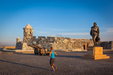 Photo for Jogging in Malecon, in front of San Salvador de la Punta castle, Havana, Cuba - Royalty Free Image