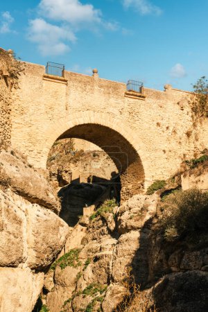 Puente Viejo (Old Bridge), Ronda, Andalusia, Spain. Built in 1616, It is the oldest of the three bridges that cross the 120 meters deep Tajo Gorge.