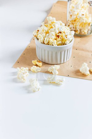 Photo for Aesthetic composition with popcorn in white bowls on white background. Autumn, winter food concept. - Royalty Free Image