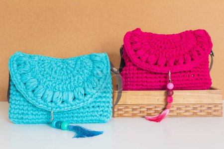 Photo for View of two female crochet bags on beige background. Fashion concept - Royalty Free Image