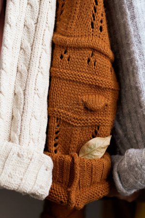 Photo for Closeup of warm sweaters and pullovers. Autumn fashion concept. - Royalty Free Image