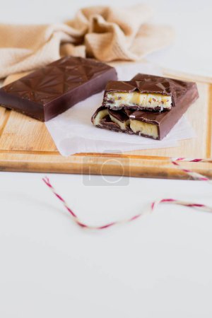 Photo for Composition with chocolate bars on wooden board - Royalty Free Image