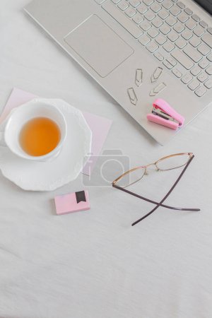 Photo for Home office desk. Women workspace with laptop, stationery on white background. Top view, flat lay. Feminine concept. - Royalty Free Image