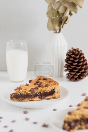 Photo for Breakfast concept. slice of tasty cookie pie with glass of milk and piece cone on background - Royalty Free Image
