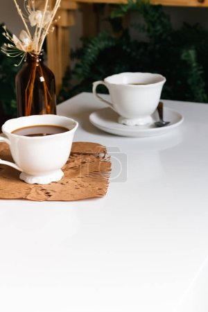 Photo for Breakfast with coffee cups on white table. - Royalty Free Image