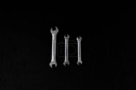 Photo for Metal wrenches on a black background - Royalty Free Image