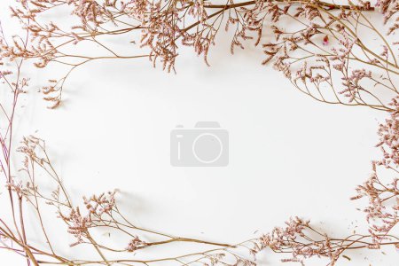 Photo for Floral frame made from lilac flowers on white background - Royalty Free Image