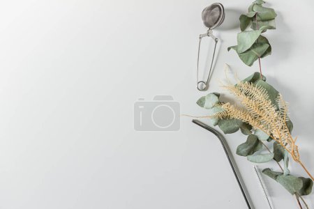 Photo for Frame with straw, cleaning brush and tea strainer on white background. Flat lay, top view, copy space. Minimalist concept. - Royalty Free Image