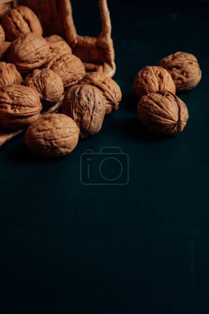 Photo for Pile of raw walnuts on dark background. - Royalty Free Image