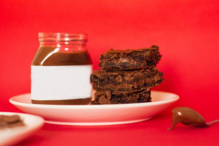Photo for Brownie on red background. Modern food styling composition - Royalty Free Image