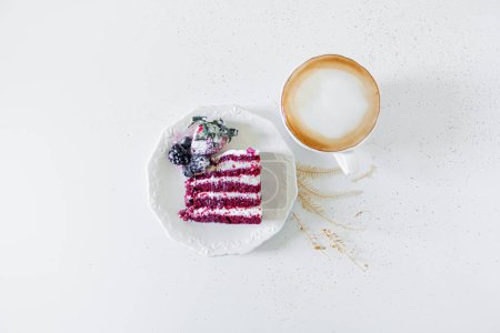 Photo for Breakfast composition with red velvet cake and a cup of milk and coffee on white background. Flat lay, top view. - Royalty Free Image