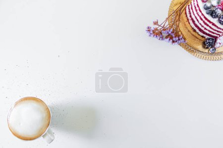 Photo for Breakfast composition with red velvet cake and a cup of milk and coffee on white background. Flat lay, top view. - Royalty Free Image