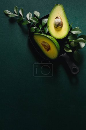 Photo for Sliced raw avocado all green arrangement. Flat lay, top view. Creative food concept. - Royalty Free Image