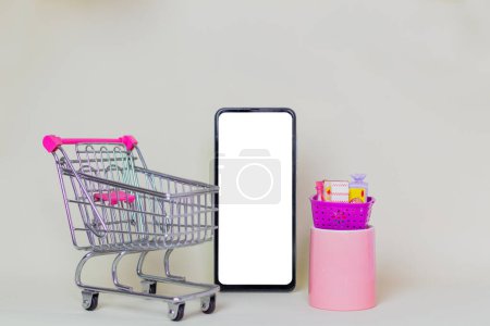 Photo for Supermarket cart on beige background. Economy concept. - Royalty Free Image