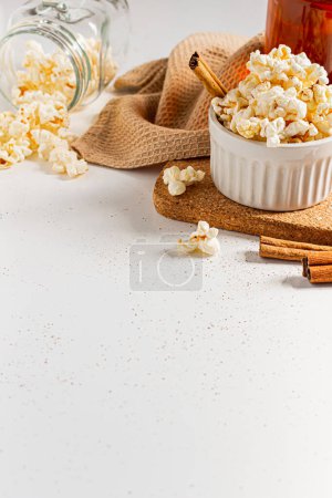 Photo for Cozy and aesthetic brown composition with popcorn on white background. Autumn, winter food concept. - Royalty Free Image