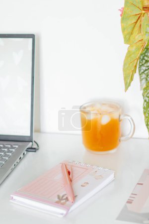 Photo for Workplace concept with office supplies, laptop and cold drink - Royalty Free Image
