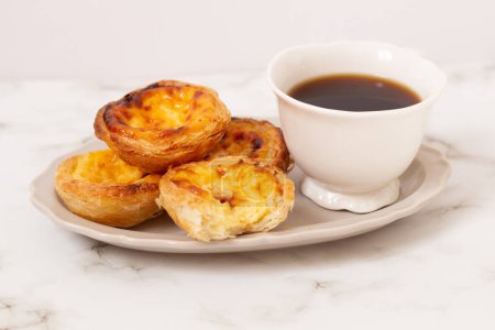 Photo for Nata Pastel. Food styling. Aesthetic composition.  Cup of coffee with egg tart dessert - Royalty Free Image