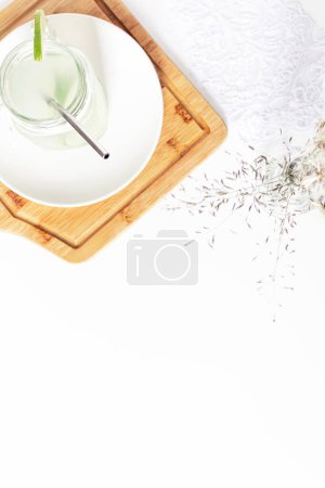 Photo for Summer cold drink concept. Glass with green lemonade and sliced citrus fruit - Royalty Free Image