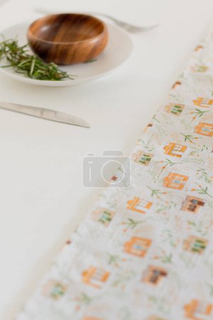 Photo for Top view of tableware with rosemary stem on white - Royalty Free Image